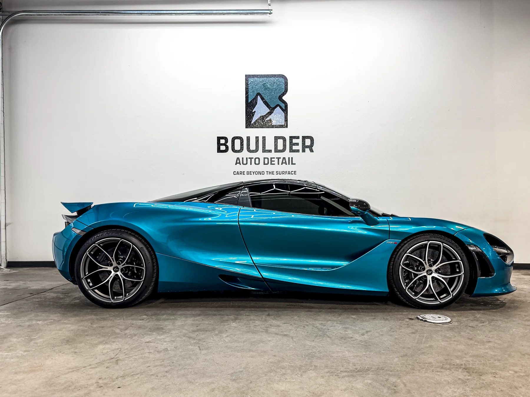 Blue McLaren 720S photographed after service inside Boulder Auto Detail