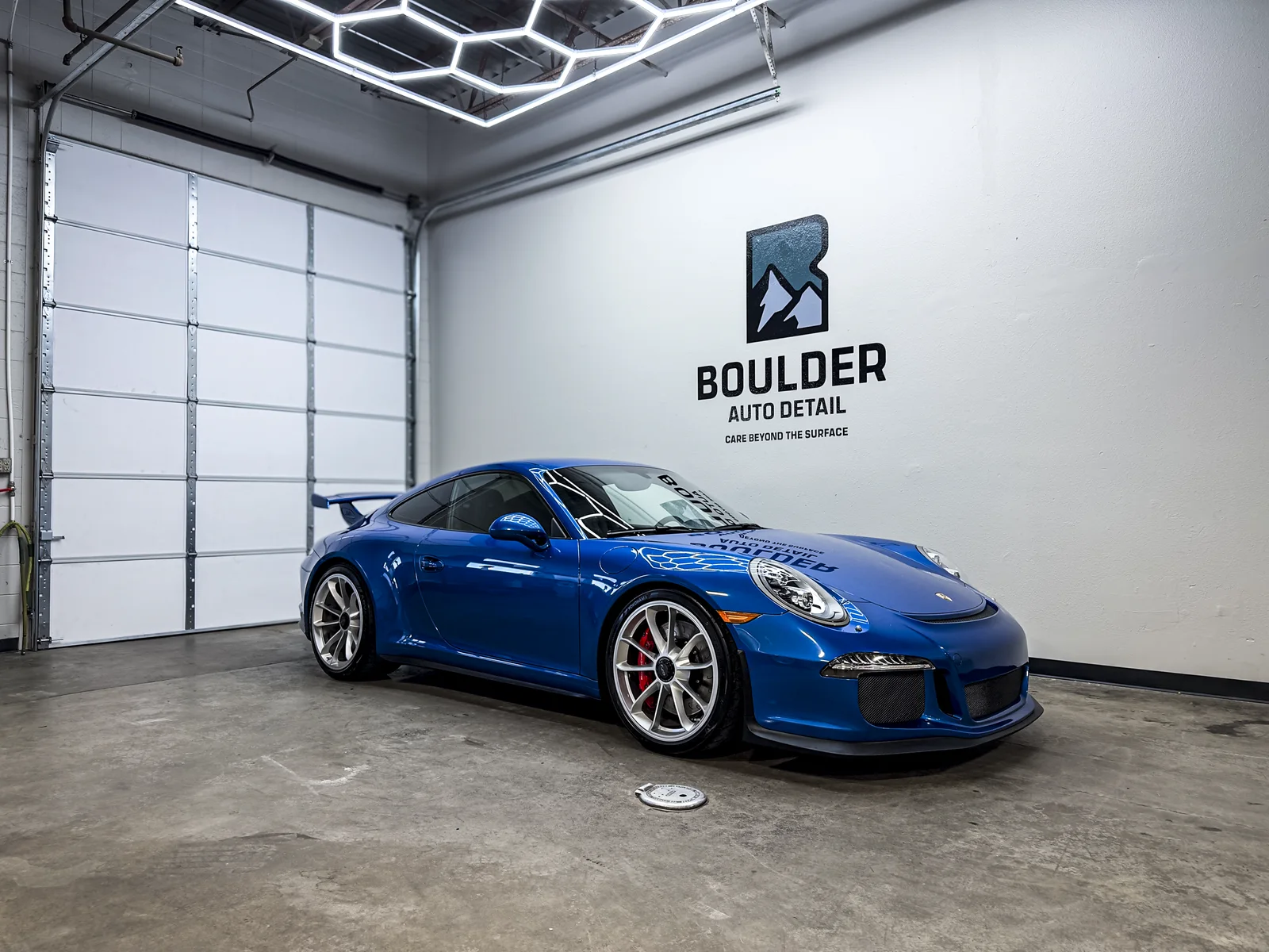 Blue Porsche 991 GT3 inside the Boulder Auto Detail workshop
